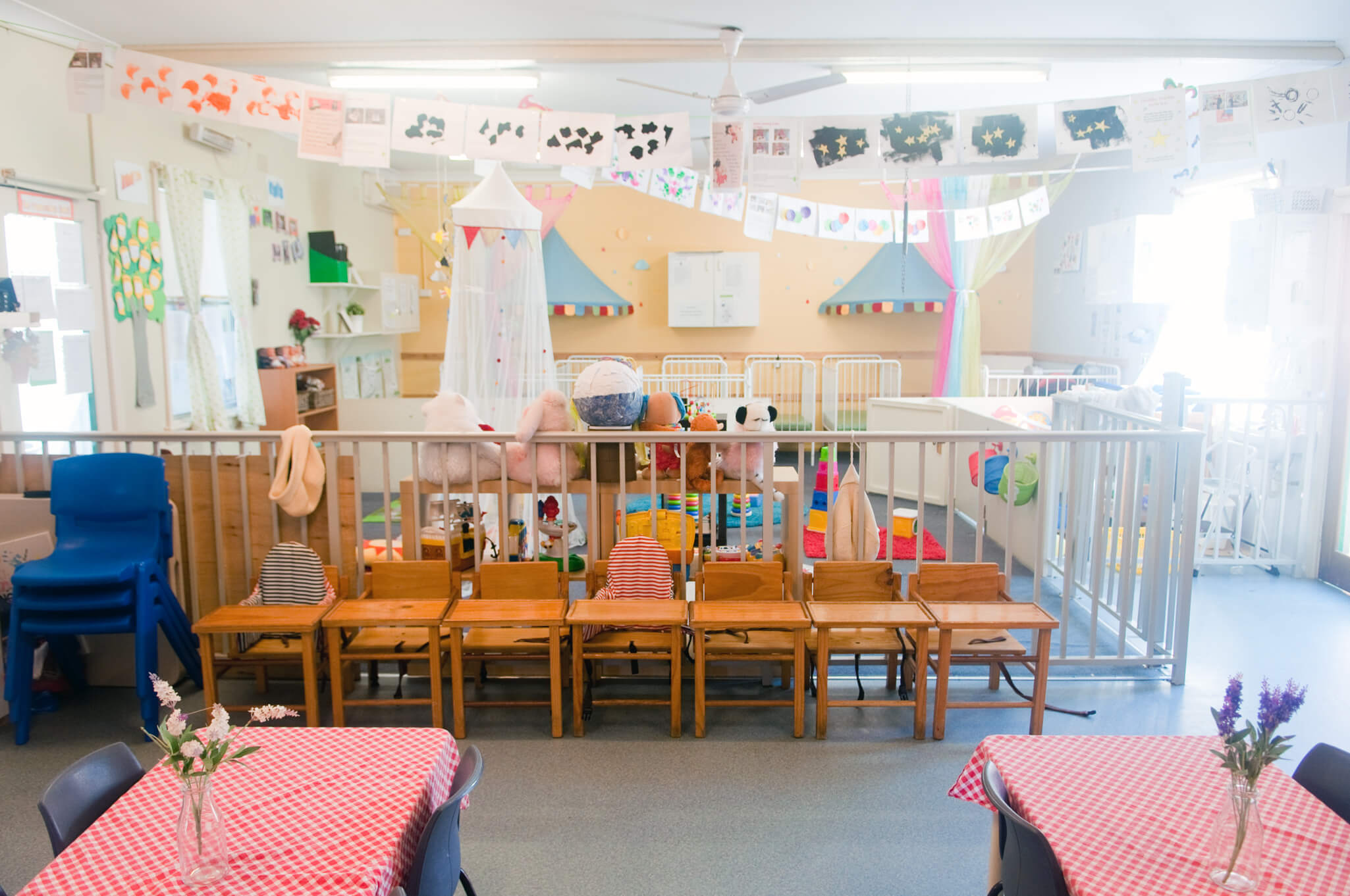 childcare room with tables and chairs