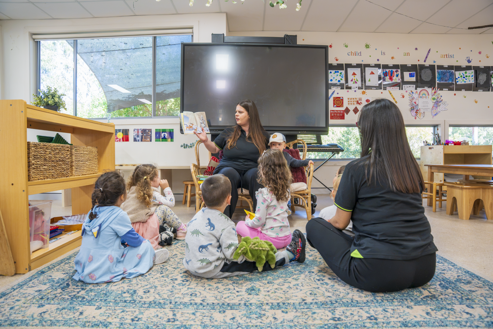 Children sitting together in a group activity at a childcare centre