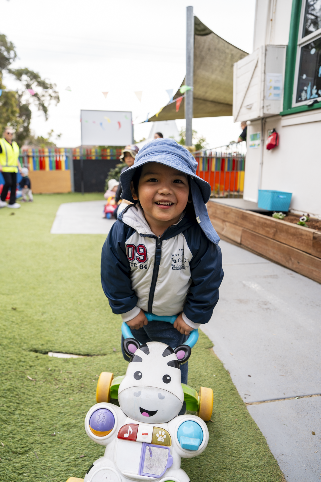 a child smiling in the playground