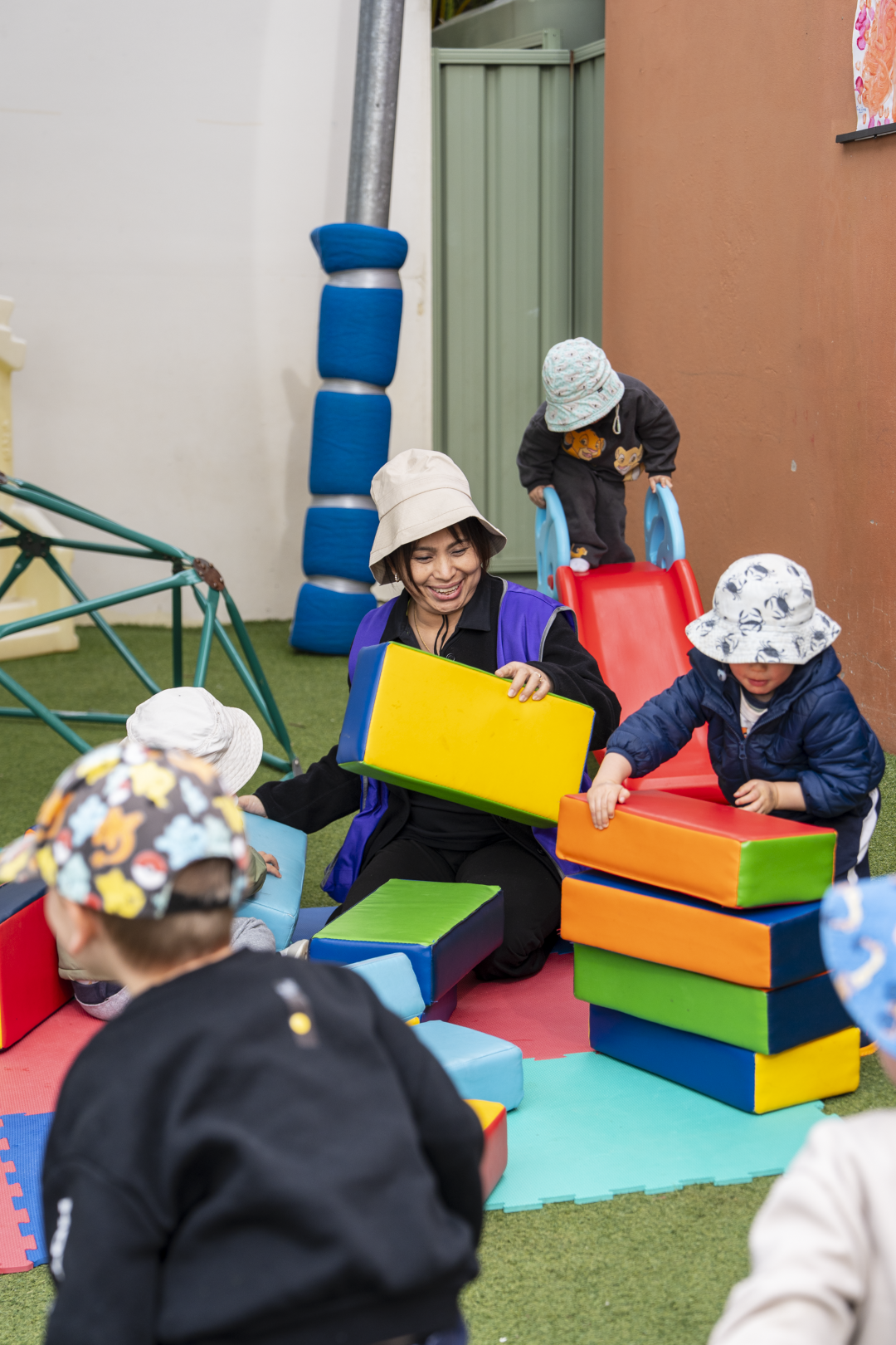 children playing alongside the educator