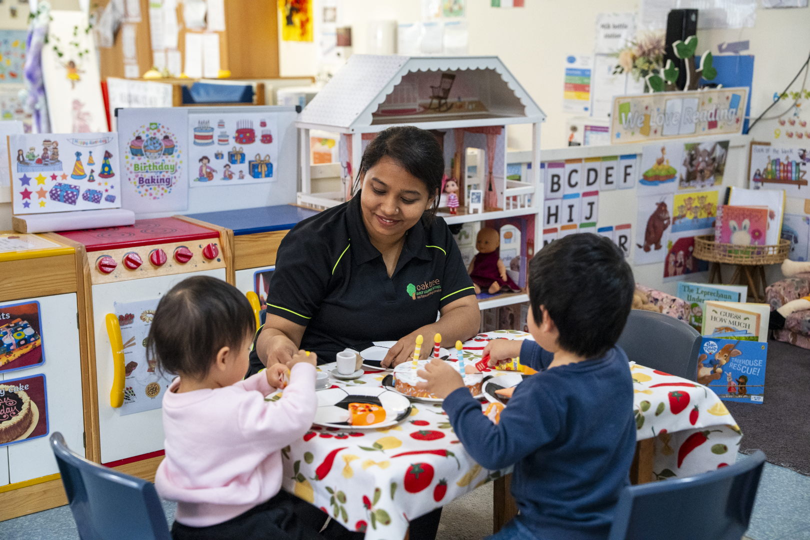 Educator and children engaged in a pretend food play activity